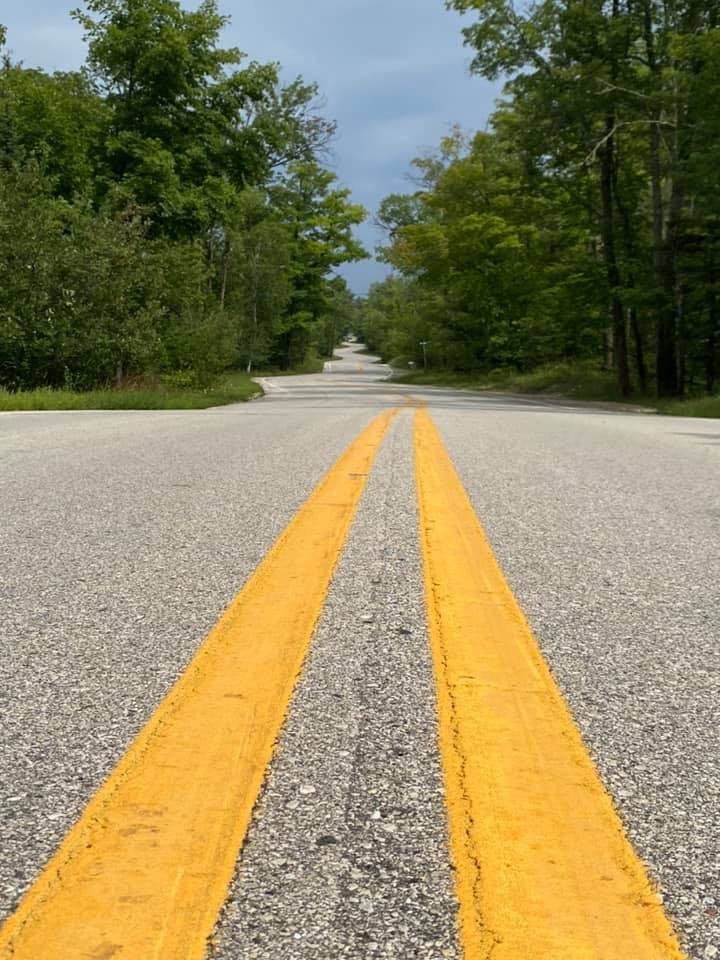 A moped parked on a Door County bluff road